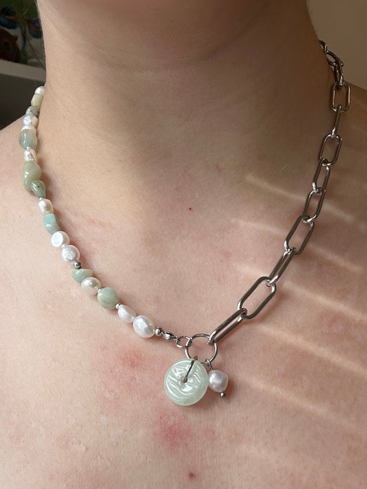 Pearl and Jade necklace worn around the neck, one half of the necklace is a paperclip chain